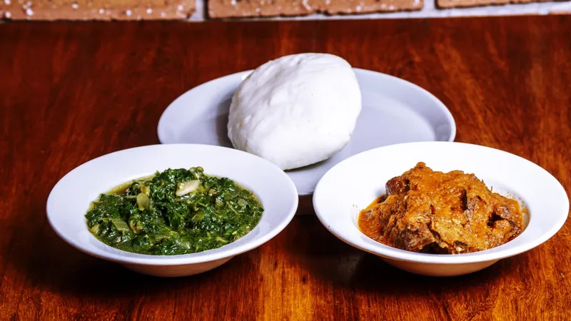 Pap, greens and stew ready at the table